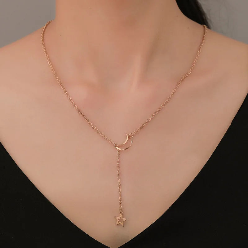 Moon and star choker necklace featuring a sleek design, ideal for stylish accessories and layered jewelry looks.