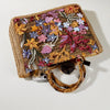 Bamboo handle straw tote bag from TheChicRoom with woven straw body and sturdy bamboo handles for casual style