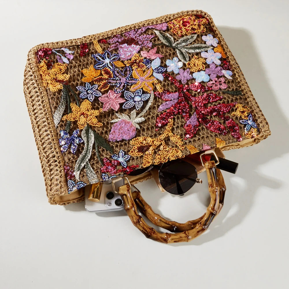 Bamboo handle straw tote bag from TheChicRoom with woven straw body and sturdy bamboo handles for casual style