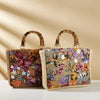 Bamboo handle straw tote bag from TheChicRoom with woven straw body and sturdy bamboo handles for casual, eco-friendly style.