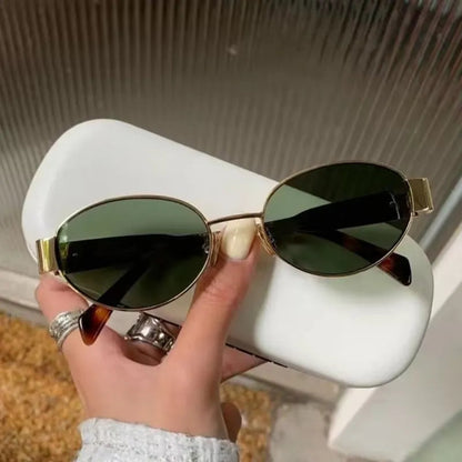 Chic oval metal sunglasses with sleek frame and tinted lenses, stylish accessories for sun protection and fashion.