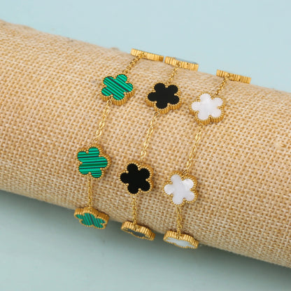 Five leaf bracelet by StorePilot featuring a delicate design with five leaf charms on a silver chain.