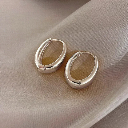 Vintage hoop drop earrings with intricate metalwork and antique finish, stylish accessories for a vintage-inspired look.
