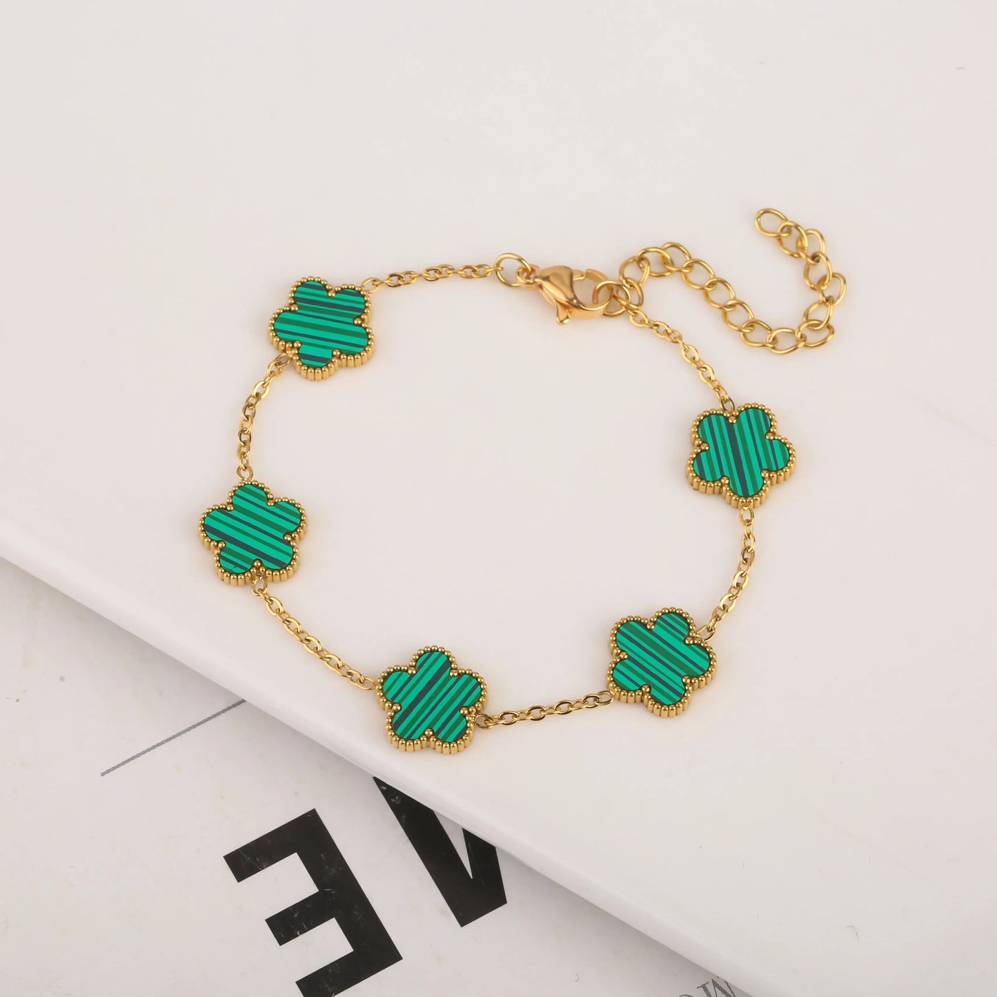 Five leaf bracelet with delicate chain and leaf charms, stylish jewelry accessory from StorePilot.