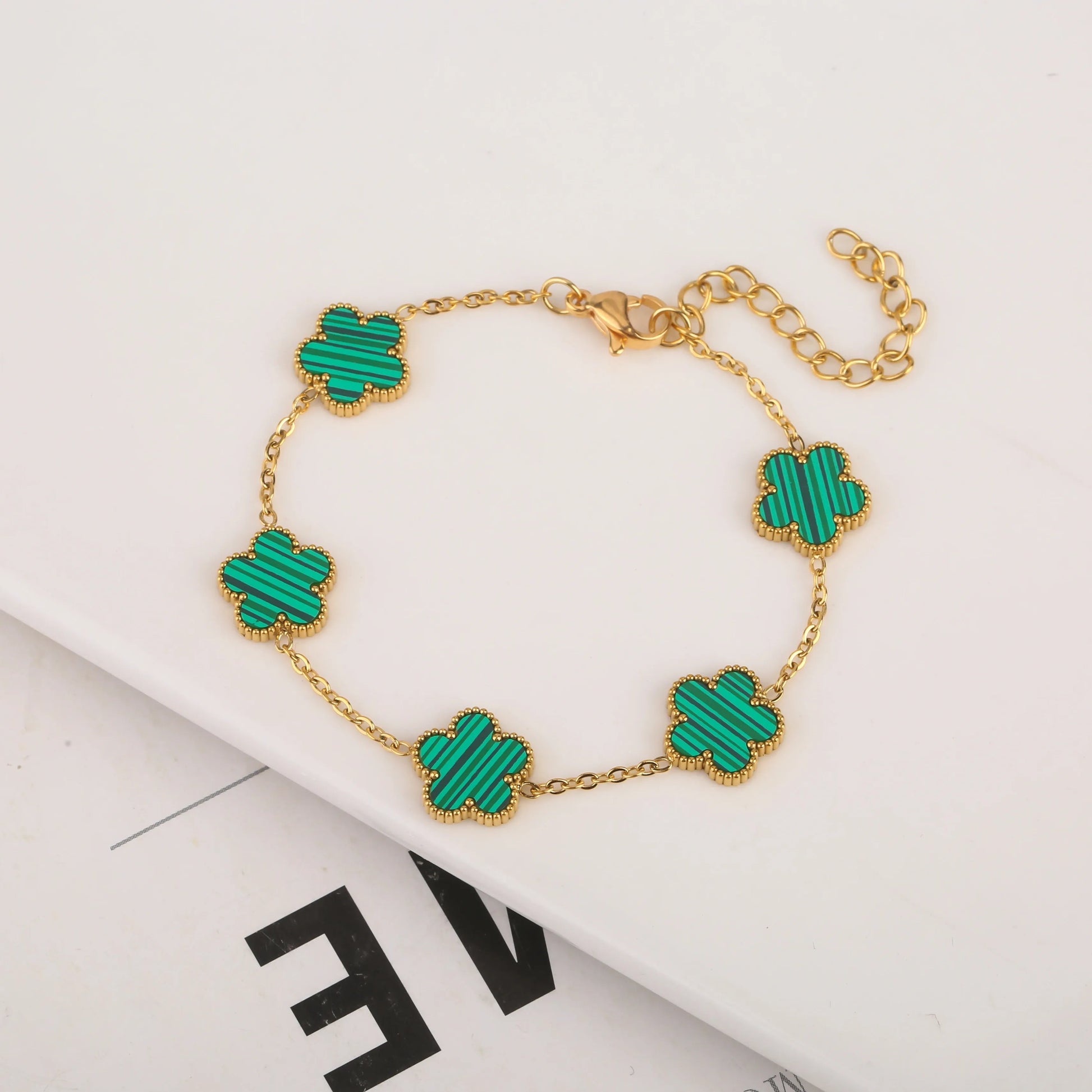 Five leaf bracelet with delicate chain and leaf charms, stylish jewelry accessory from StorePilot.
