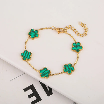 Five leaf bracelet with delicate chain and leaf charms, stylish jewelry accessory from StorePilot.
