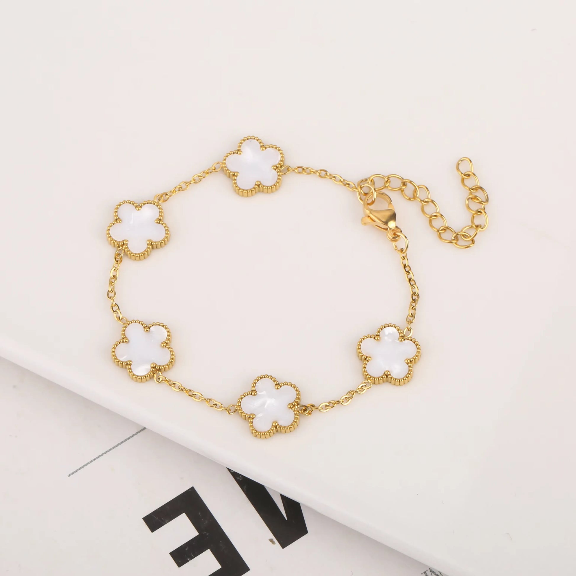 Delicate five-leaf bracelet from StorePilot with intricate leaf details in silver tone, designed for elegant wrist wear.