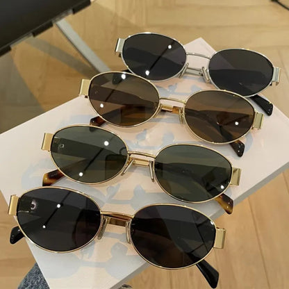 Chic oval metal sunglasses with sleek frames and tinted lenses, stylish accessory from StorePilot.