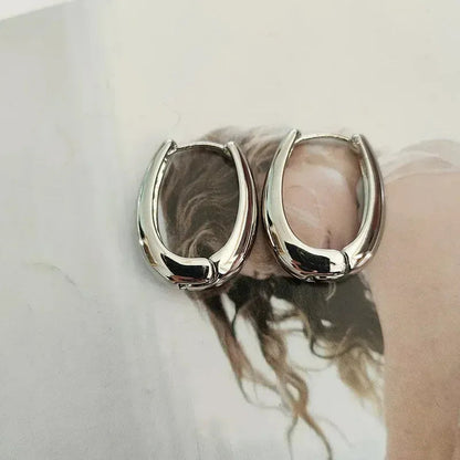 Vintage hoop drop earrings with intricate metalwork and antique finish, stylish jewelry accessory from StorePilot.
