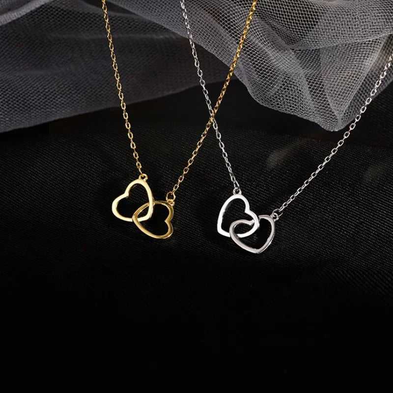 Elegant heart pendant necklace for women featuring a silver chain and a polished heart-shaped charm.