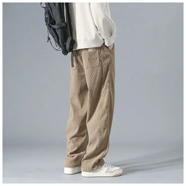 Men's trendy corduroy pants in a classic fit, made by StorePilot, shown in a versatile dark color with a focus on the fabric texture.