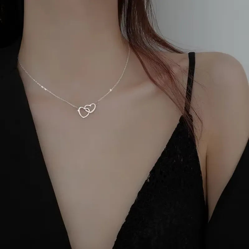 Silver heart pendant necklace for women featuring a delicate design, from StorePilot, displayed on a chain against a neutral background.