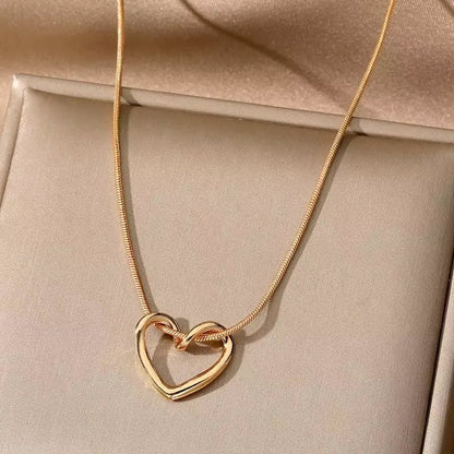 Silver heart pendant necklace with a delicate chain, featuring a polished, romantic heart-shaped charm from StorePilot.