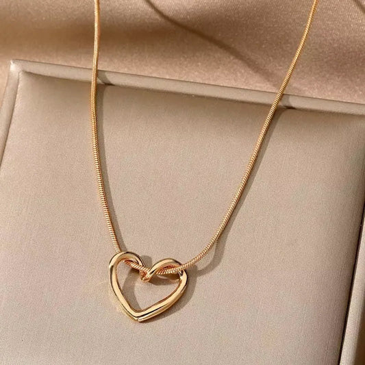 Silver heart pendant necklace with a delicate chain, featuring a polished, romantic heart-shaped charm from StorePilot.