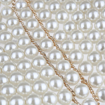 Elegant pearl body chain jewelry draped over a model's torso, showcasing the stylish and delicate design of the StorePilot Pearl Body Chain.