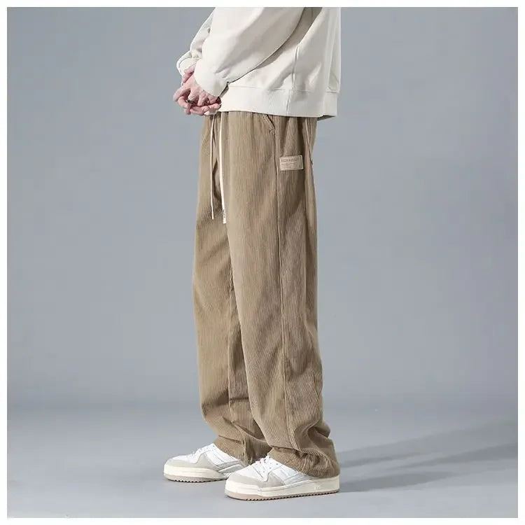 Men's trendy corduroy pants in a stylish fit, shown in a neutral color, featuring classic corduroy fabric and modern design.