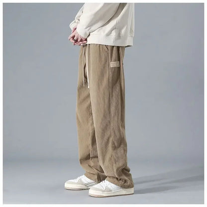Men's trendy corduroy pants in a stylish fit, shown in a neutral color, featuring classic corduroy fabric and modern design.