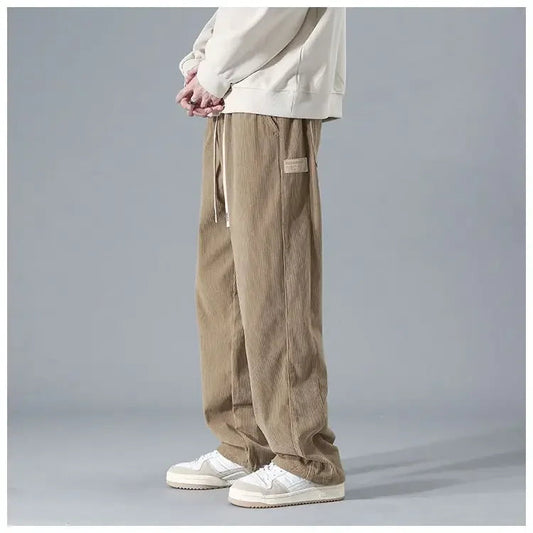 Men's trendy corduroy pants in a stylish fit, shown in a neutral color, featuring classic corduroy fabric and modern design.
