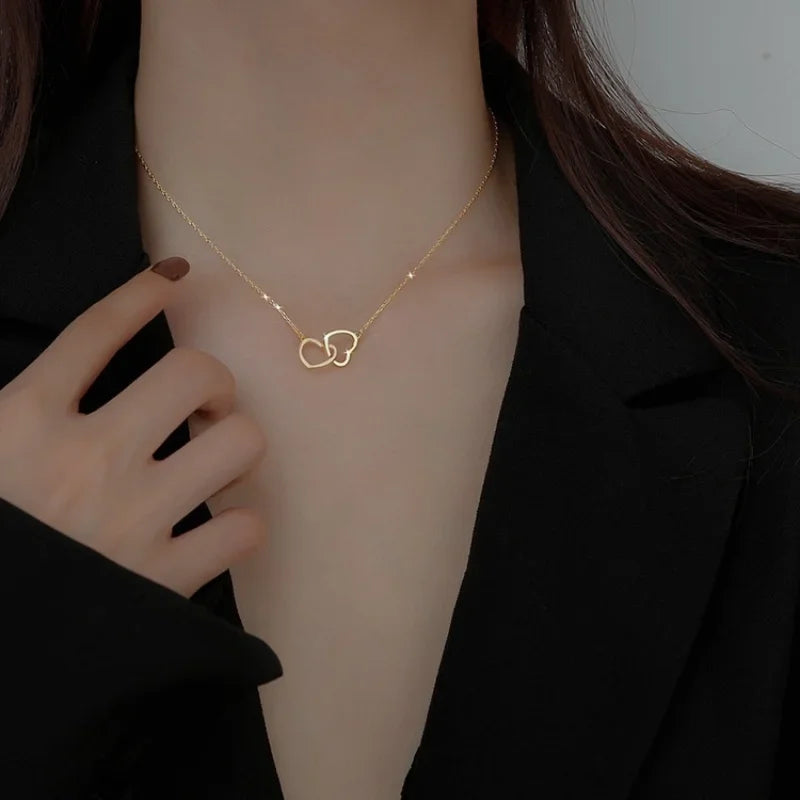 Elegant silver heart pendant necklace for women featuring a delicate chain and a shining heart-shaped pendant.