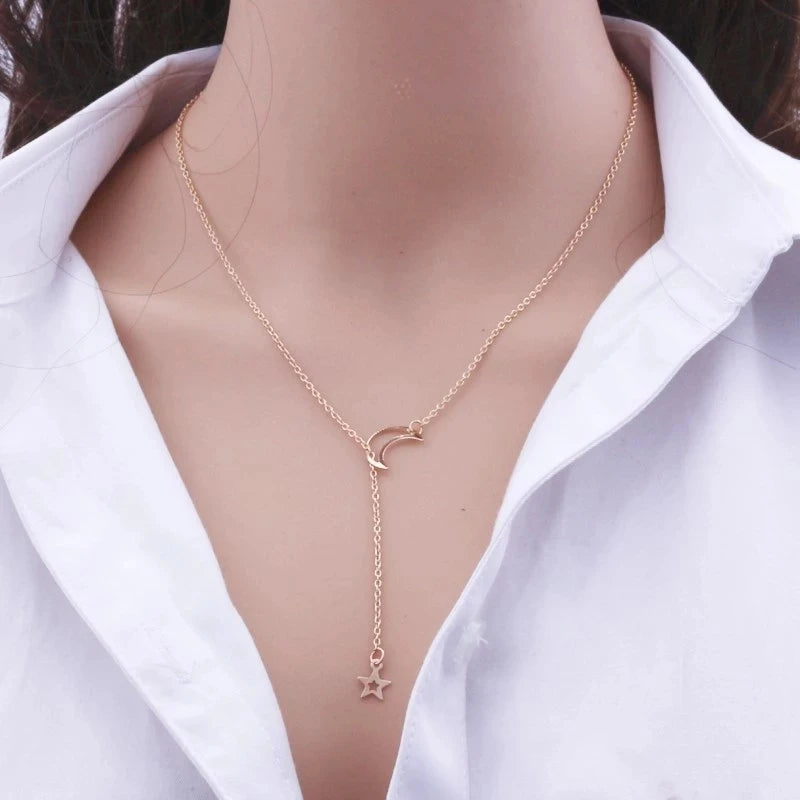 Moon and star choker necklace by StorePilot featuring a delicate chain with moon and star pendant.