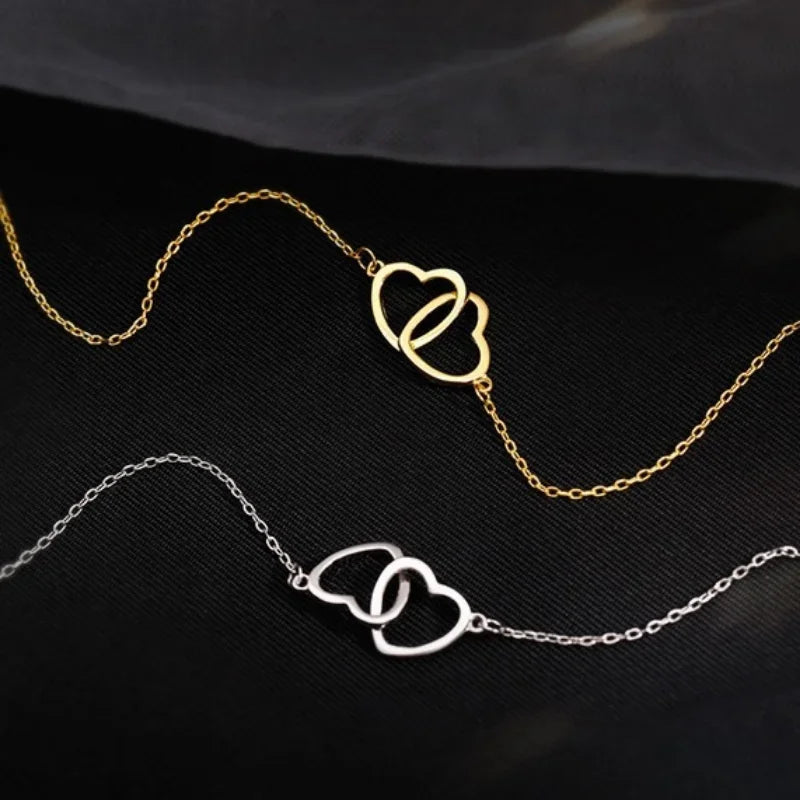 Heart pendant necklace for women featuring a silver chain and a delicate heart-shaped charm, stylish jewelry accessory.
