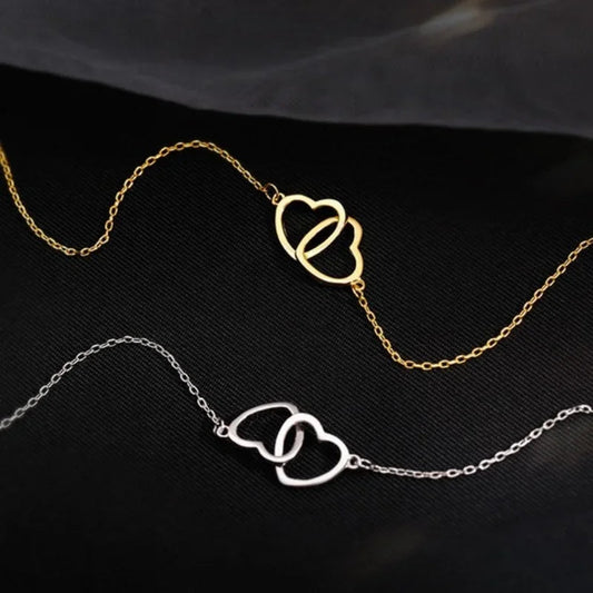 Heart pendant necklace for women featuring a silver chain and a delicate heart-shaped charm, stylish jewelry accessory.