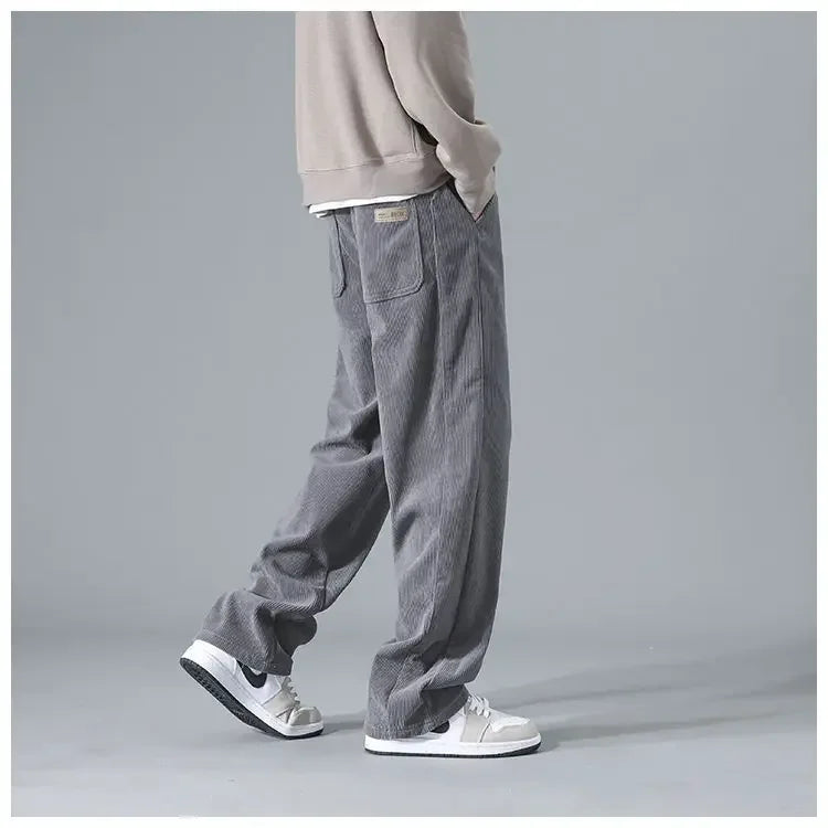 Men's trendy corduroy pants in a classic fit, featuring textured fabric and versatile style, shown in a neutral color.