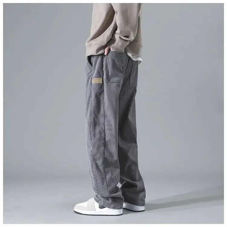 Men's trendy corduroy pants in a classic fit, shown in a neutral color with a focus on the textured fabric and stylish design.