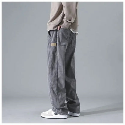 Men's trendy corduroy pants in a classic fit, shown in a neutral color with a focus on the textured fabric and stylish design.