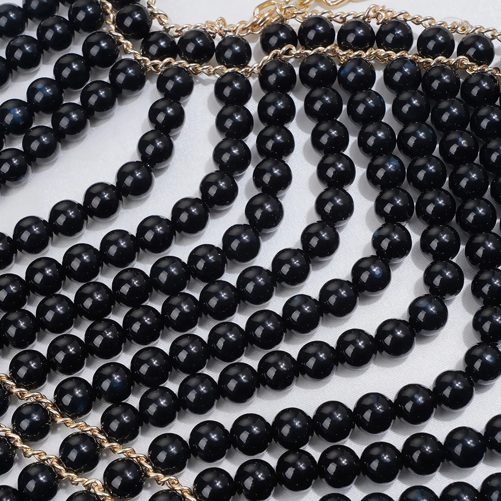 Elegant pearl body chain jewelry top featuring delicate pearls and sleek design, perfect for stylish summer fashion.