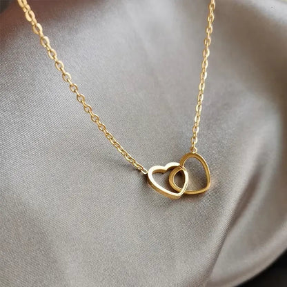 Elegant heart pendant necklace for women featuring a silver chain and a sparkling heart-shaped charm.