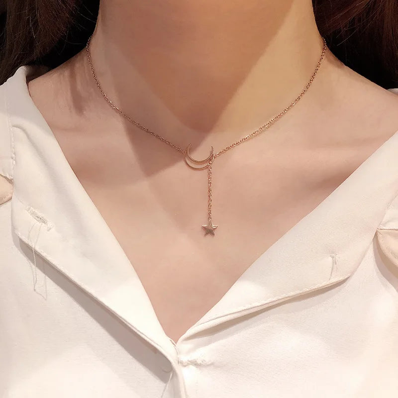 Silver Moon and Star Choker Necklace by StorePilot featuring a delicate chain and celestial pendant design