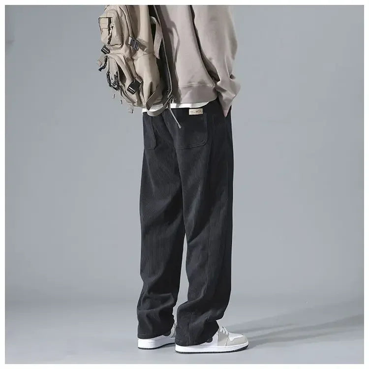 Men's trendy corduroy pants in a classic fit, featuring a rich texture and stylish detailing, perfect for casual or smart-casual wear.