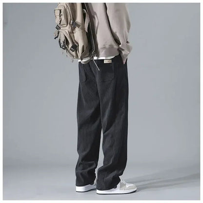 Men's trendy corduroy pants in a classic fit, featuring a rich texture and stylish detailing, perfect for casual or smart-casual wear.