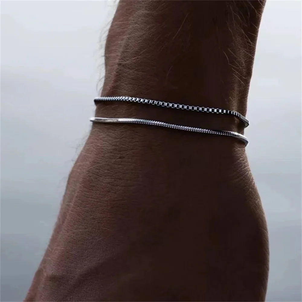 Gold snake chain bracelet with sleek, twisting design, featuring a polished finish, perfect for stylish jewelry collection.
