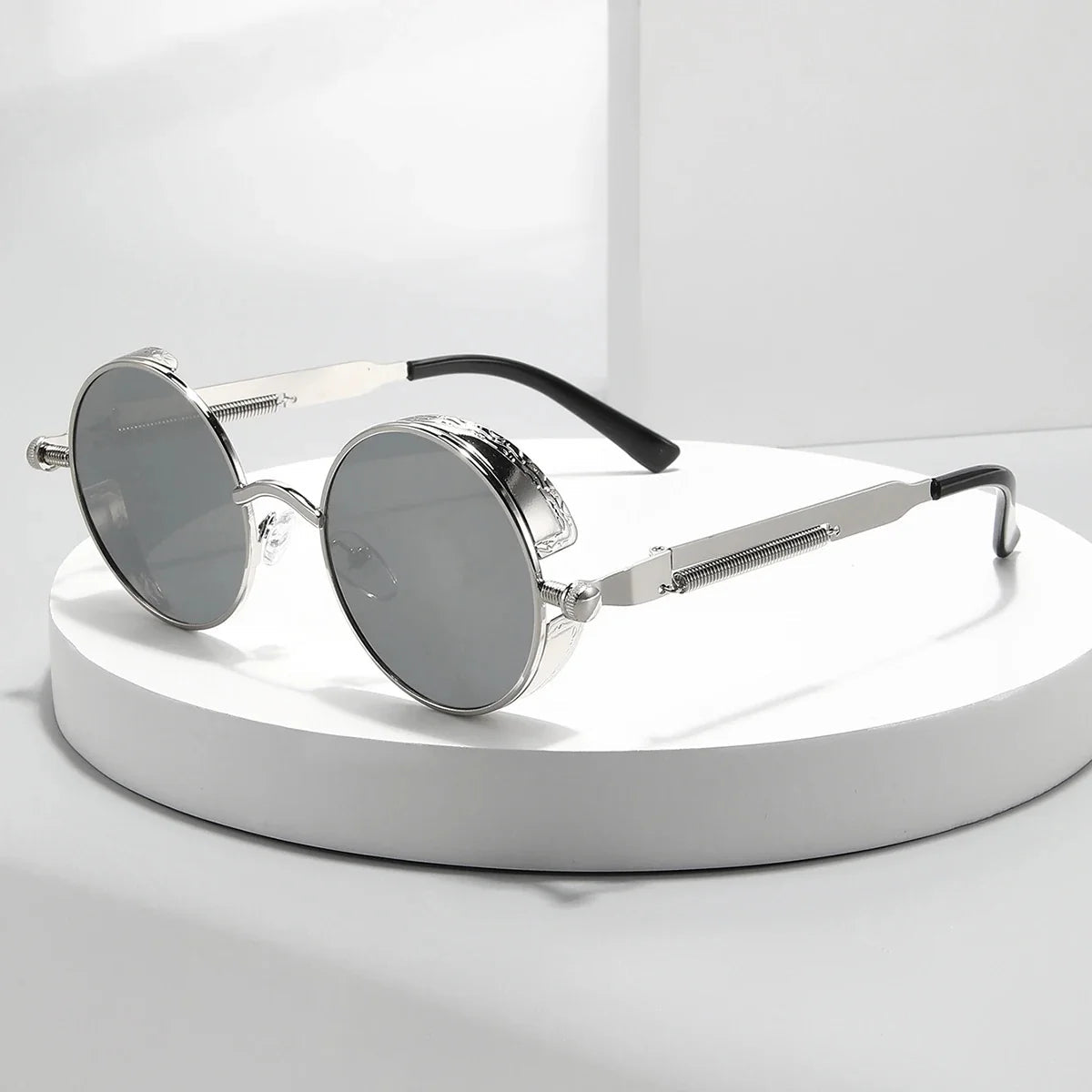 Steampunk metal round sunglasses with intricate detailing and dark tinted lenses, stylish eyewear by StorePilot