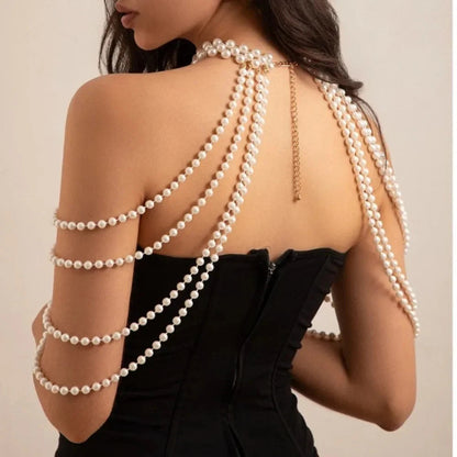 Glam Pearl Body Chain Necklace by StorePilot featuring elegant pearl accents and delicate chain design on a model.