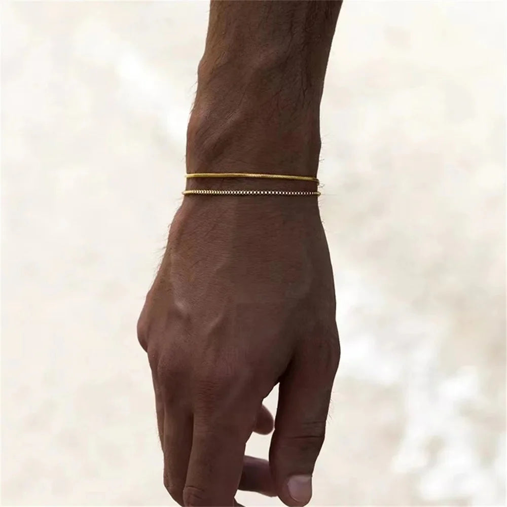 Gold Snake Chain Bracelet with a smooth, flexible design, showcasing shiny gold links on a plain background.