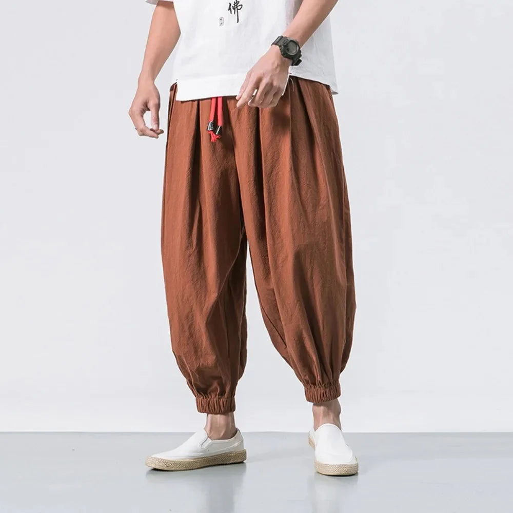 Men's chic harem joggers from StorePilot, featuring a relaxed fit and stylish design, shown in a dark color with comfortable fabric.