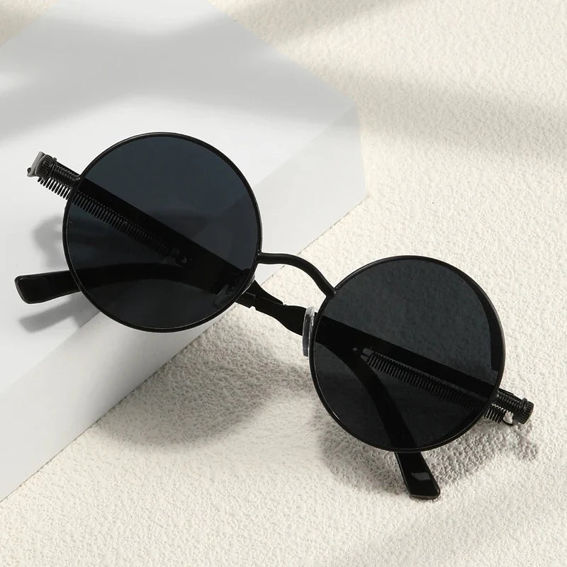 Steampunk metal round sunglasses with vintage-style frames and dark lenses, stylish accessory from StorePilot.