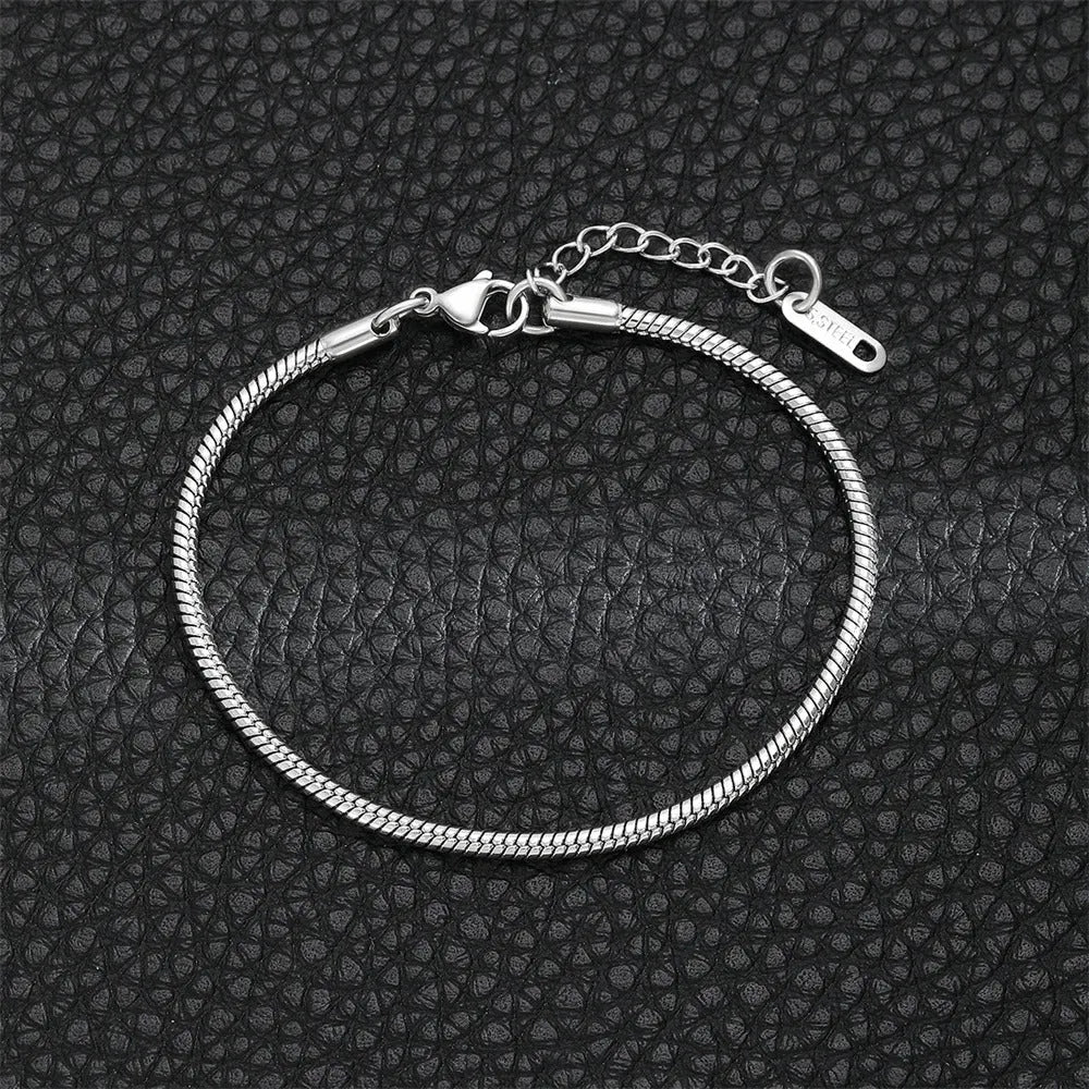 Gold snake chain bracelet from StorePilot featuring a sleek, shiny design with interlocking links, close-up view.