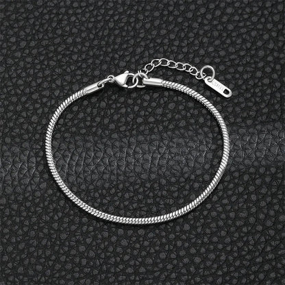 Gold snake chain bracelet from StorePilot featuring a sleek, shiny design with interlocking links, close-up view.
