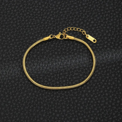 Gold snake chain bracelet from StorePilot, close-up of sleek, shiny gold links forming a stylish jewelry accessory.