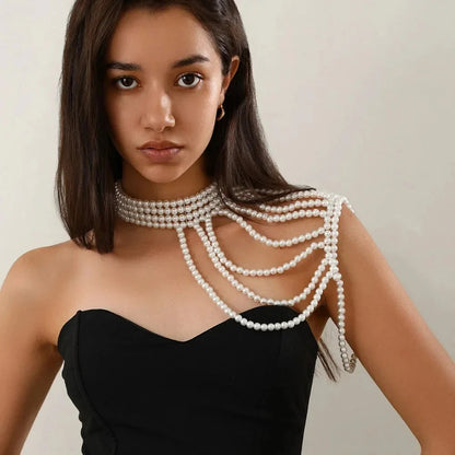 Glam Pearl Body Chain Necklace by StorePilot featuring shimmering pearl accents and delicate chain design on a model.
